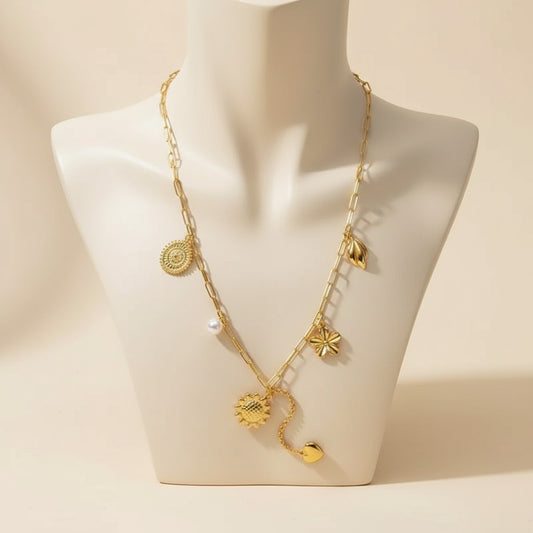 Aramat Jewels gold-tone stainless steel necklace with pearl, coin, flower, leaf, and heart charms. Adjustable 45+5 cm.