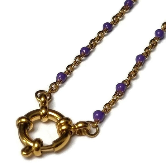 Aramat Jewels gold-tone stainless steel necklace with small purple enamel beads and a large clasp.