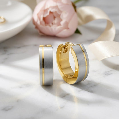 Aramat Jewels bicolor stainless steel hoop earrings with a matte silver finish and a gold stripe detail, 13mm.