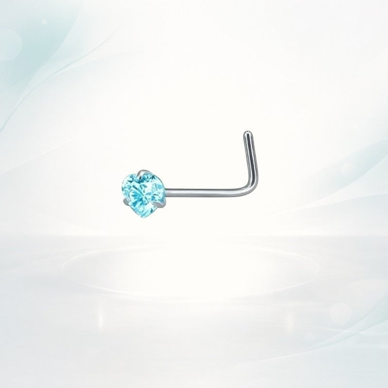 Aramat Jewels silver L-shaped nose stud with a small blue heart-shaped zirconia stone.