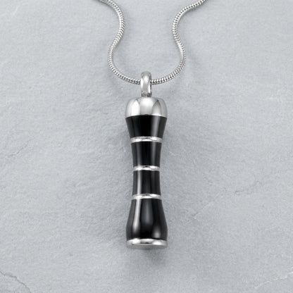 Aramat Jewels zwarte en zilverkleurige buis ashanger van 316L edelstaal met schroefsluiting.