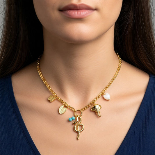 Aramat Jewels gold-tone gourmet chain necklace with butterfly, snake, elephant, blue stone, and shell heart charms. Adjustable 45+5cm.