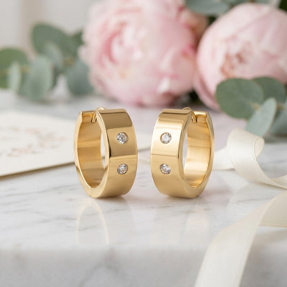 Aramat Jewels gold-tone stainless steel hoop earrings with two clear cubic zirconia stones on each hoop, 13mm or 20mm diameter.