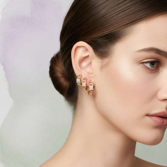 Aramat Jewels gold-tone chain link hoop earrings and ear crawlers with clear cubic zirconia accents.