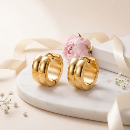 Aramat Jewels gold-colored stainless steel hoop earrings with a single stripe design, 13mm diameter.