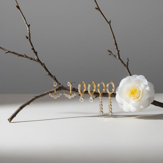 Aramat Jewels set of 3 pairs of gold-plated 925 silver earrings with clear and green cubic zirconia stones.