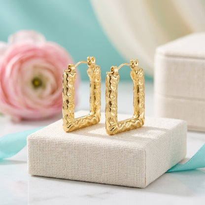 Aramat Jewels gold rectangular hoop earrings with a textured stripe pattern, 26x18mm, featuring a hinge closure.