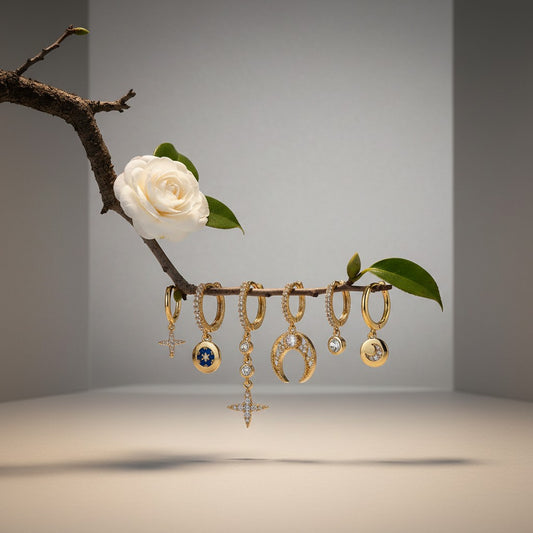 Aramat Jewels gold-plated 925 silver earrings set with stars, moons, and cubic zirconia.