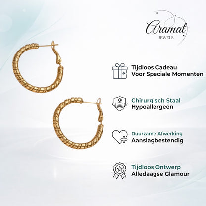 Aramat Jewels gold-tone stainless steel hoop earrings with a textured swirl design, 30mm diameter.