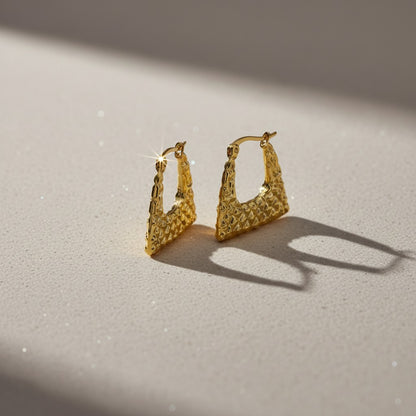 Aramat Jewels gold-tone stainless steel trapeze hoop earrings with a diamond pattern texture, 22mm.