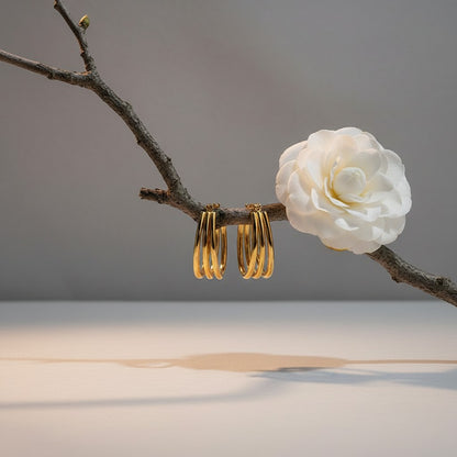 Aramat Jewels gold oval triple hoop earrings, 26x18mm, made of stainless steel with an open design.