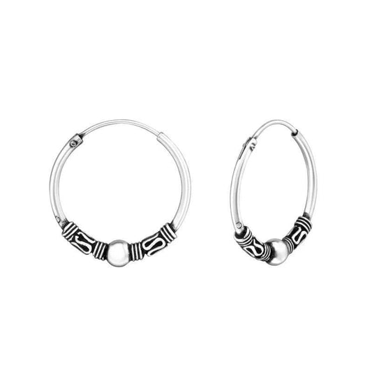 Aramat Jewels 18mm oxidized silver hoop earrings with intricate ethnic Bali design.
