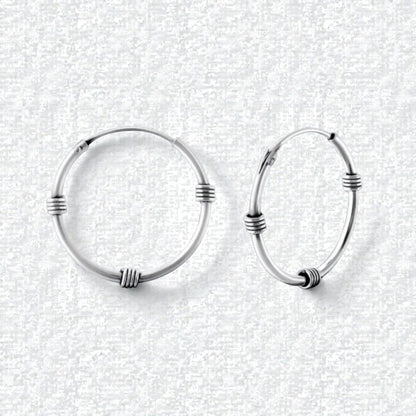 Aramat Jewels oxidized silver Bali hoop earrings, 20mm diameter, with textured detailing. Boho style.