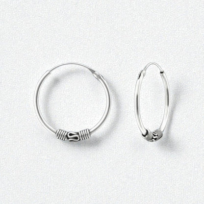 Aramat Jewels 20mm oxidized silver Bali hoop earrings with intricate detailing, perfect for a boho or elegant style.