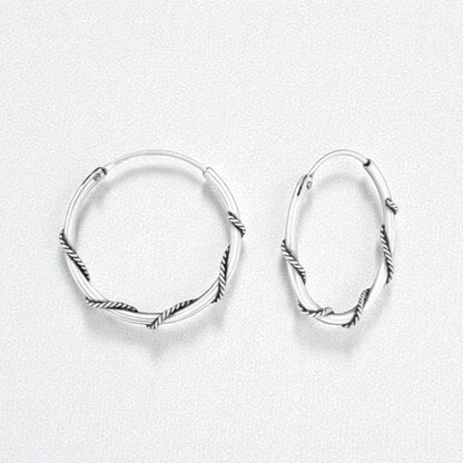 Aramat Jewels 20mm oxidized silver Bali hoop earrings with a twisted rope design. These ethnic hoops have a rustic, vintage look.