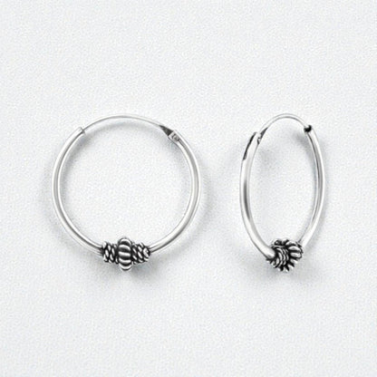 Aramat Jewels 18mm silver Bali hoop earrings with intricate ethnic design and oxidized finish.