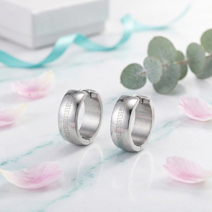 Aramat Jewels silver stainless steel hoop earrings with Greek key pattern, 13mm diameter, 7mm width.