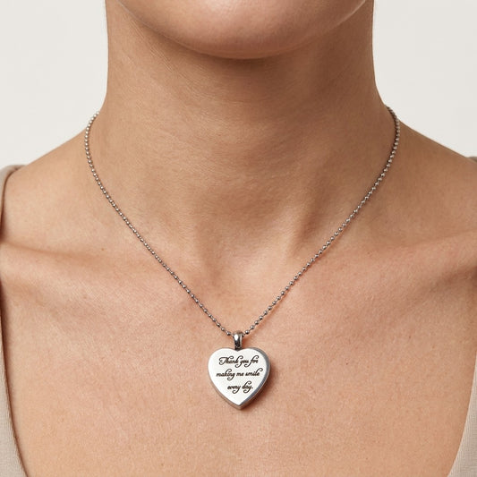 Aramat Jewels silver stainless steel heart-shaped ash pendant with "Thank you for making me smile every day" engraving.