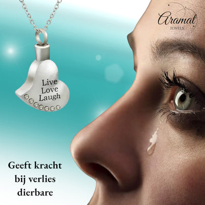 Aramat Jewels silver heart-shaped cremation urn pendant with "Live Love Laugh" engraving and crystal accents.