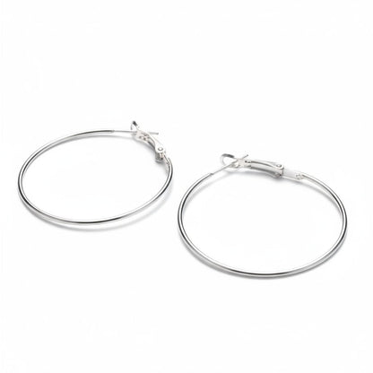 Aramat Jewels silver-coloured metal hoop earrings, 40mm diameter, with a click-top clasp. Lightweight and versatile.