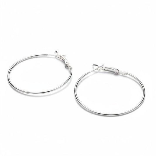 Aramat Jewels silver-coloured metal hoop earrings, 40mm diameter, with a click-top clasp. Lightweight and versatile.
