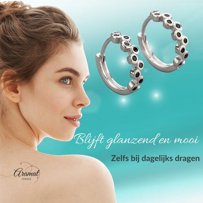 Aramat Jewels silver hoop earrings with black cubic zirconia stones, 12mm diameter.