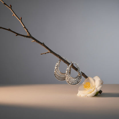 Aramat Jewels silver-tone stainless steel hoop earrings with a 6-in-1 layered design, featuring a mix of textured and smooth bands.