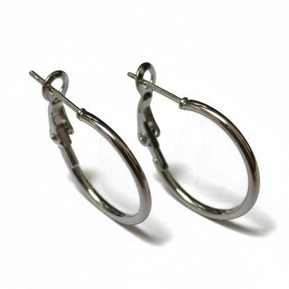 Aramat Jewels silver stainless steel hoop earrings with a high-gloss finish and hinge closure, available in multiple sizes.