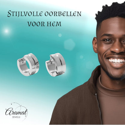 Aramat Jewels silver-tone stainless steel huggie hoop earrings with a double-line accent, worn by a smiling man.