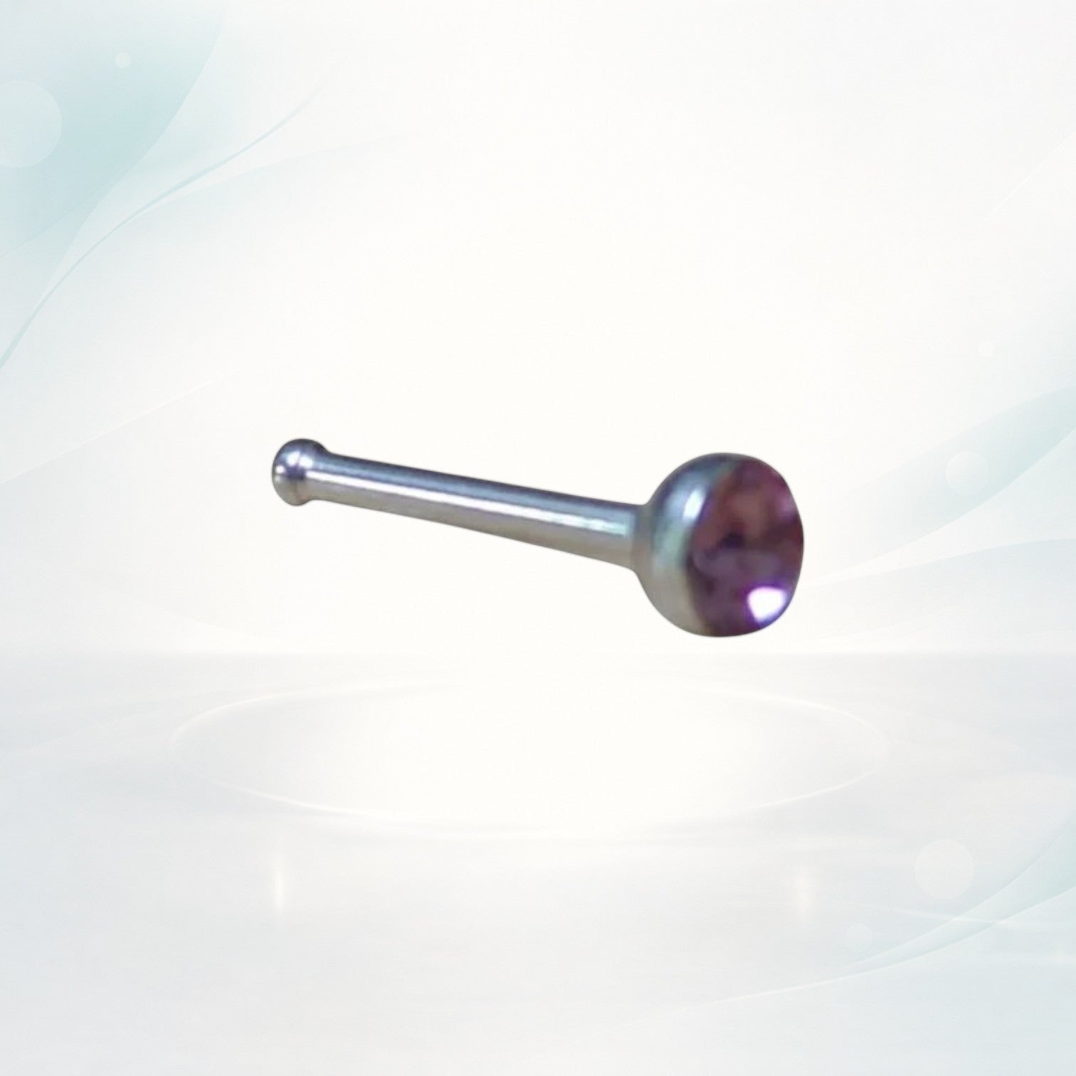 Aramat Jewels silver steel nose stud with a 2mm purple crystal stone, straight design.