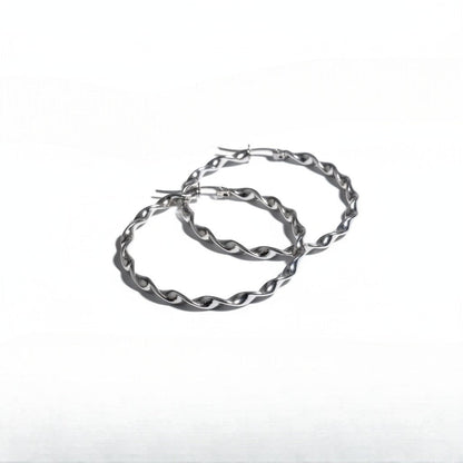 Aramat Jewels silver-tone twisted hoop earrings, 40mm diameter, high-gloss finish, stainless steel.