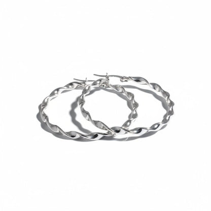 Aramat Jewels silver-tone twisted hoop earrings, 40mm diameter, high-polish stainless steel, elegant statement jewelry.
