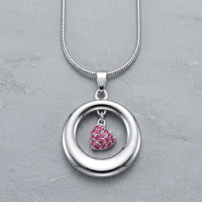 Aramat Jewels® stalen ashanger open cirkel met roze kristal hart, RVS gedenksieraad