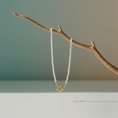 Aramat Jewels white Rocailles beaded necklace with gold clasp, 42cm length, handmade from stainless steel.