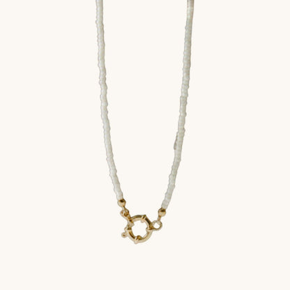 Aramat Jewels white Rocailles beaded necklace with gold clasp, 42cm length, handmade from stainless steel.