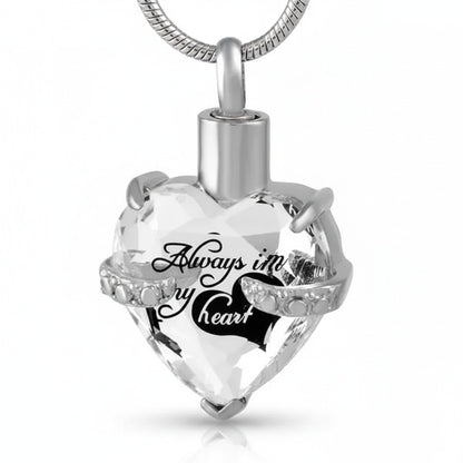 Aramat Jewels zilverkleurige hart crematiehanger van 316L staal met zirkonia en gravure 'Always in my heart'.