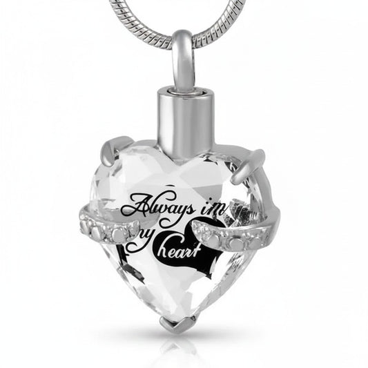 Aramat Jewels zilverkleurige hart crematiehanger van 316L staal met zirkonia en gravure 'Always in my heart'.