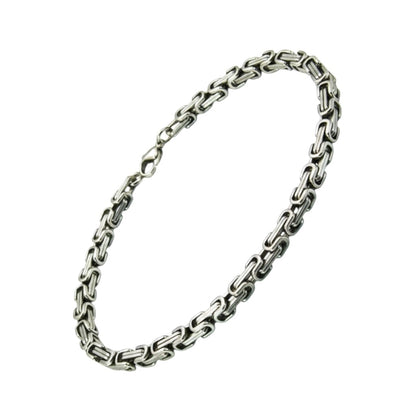 Zilverkleurige Aramat Jewels koningsschakel armband van 5mm breed RVS met een plat design.