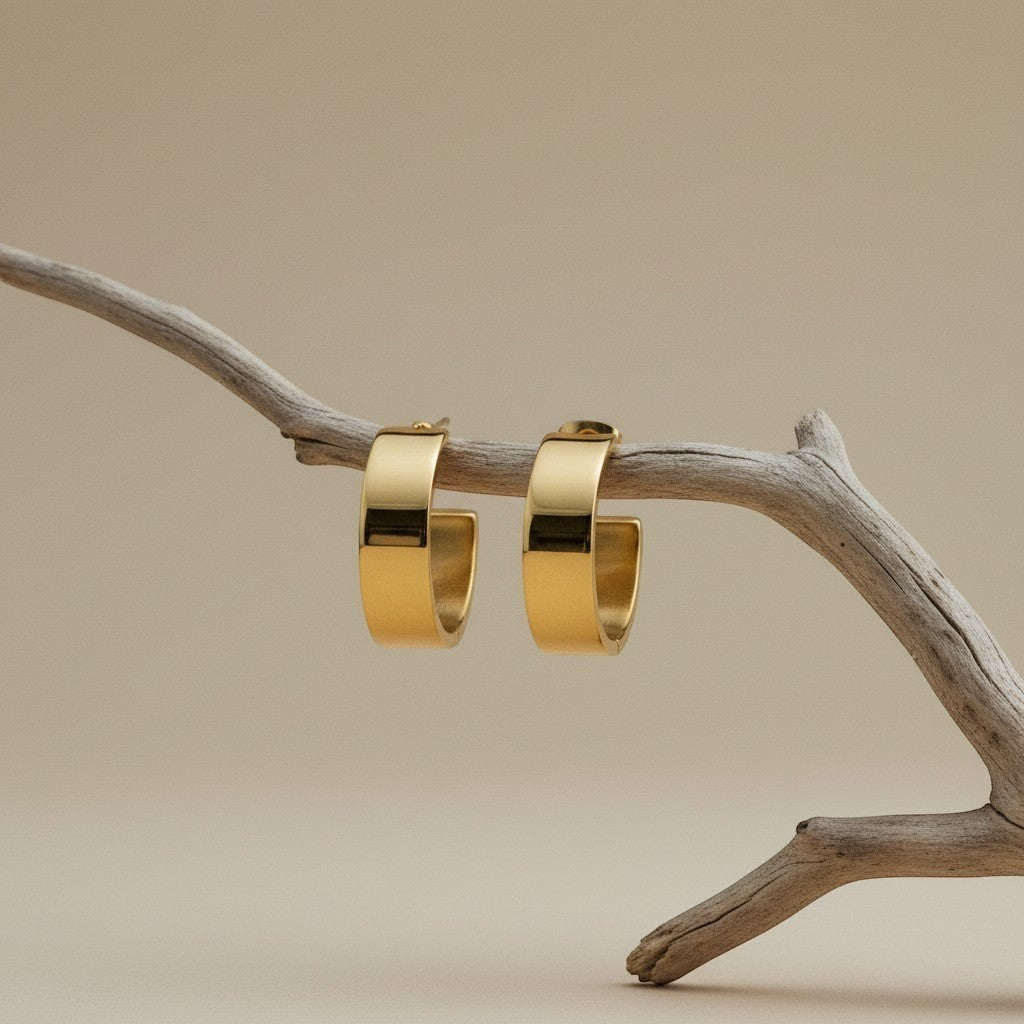 Brede RVS Oorringen Glad Glanzend Goudkleur 23mm x 7mm - Aramat Jewels - Oorringen - cadeautip