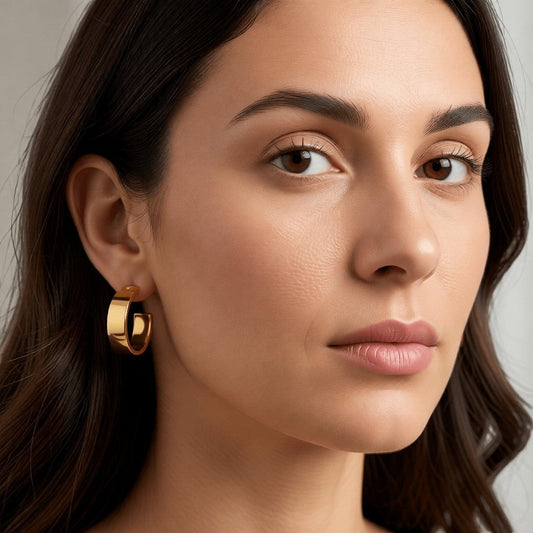 Brede RVS Oorringen Glad Glanzend Goudkleur 23mm x 7mm - Aramat Jewels - Oorringen - cadeautip