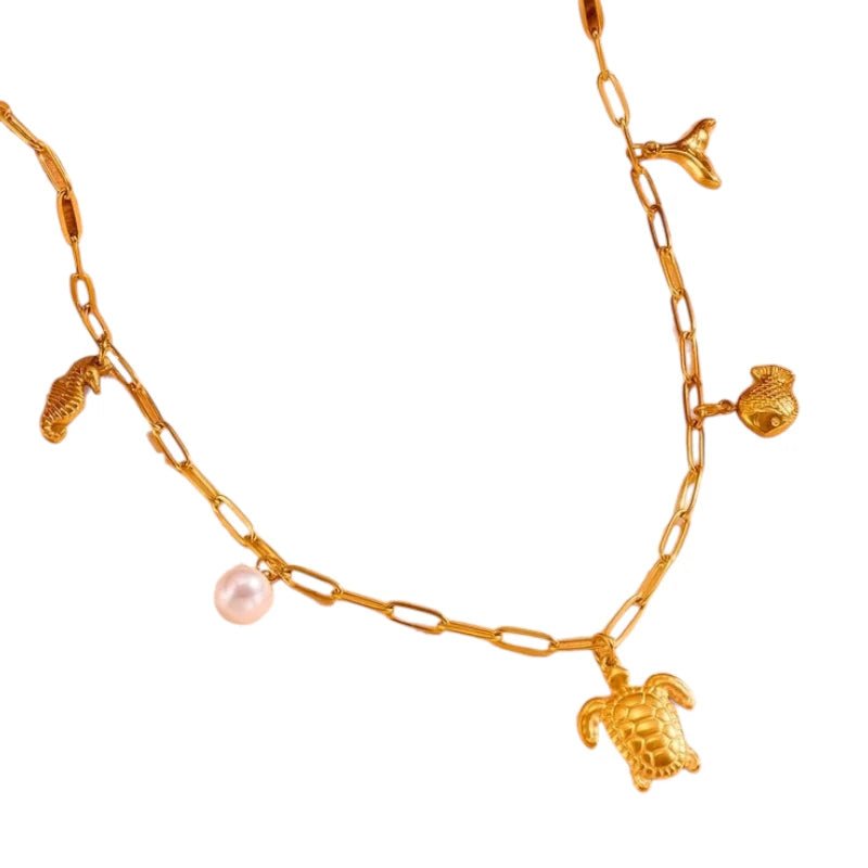 Goudkleurige damesketting met parel & zee - bedels – 45 cm - ket1174 - 511141 - Halskettingen kopen# - 45cm - alles - Bedelketting