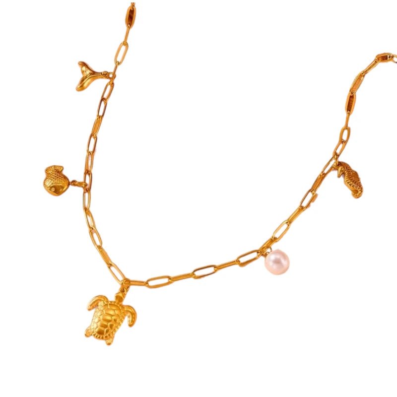 Goudkleurige damesketting met parel & zee - bedels – 45 cm - ket1174 - 511141 - Halskettingen kopen# - 45cm - alles - Bedelketting