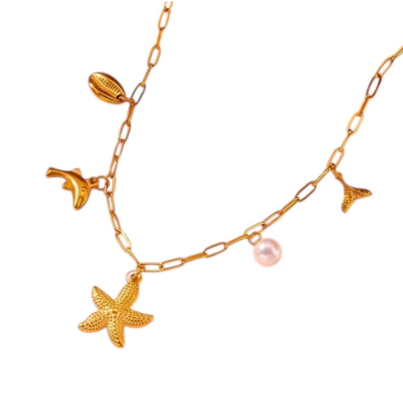 Goudkleurige damesketting met zee - bedels en parel – 45 cm - ket1170 - 511142 - Halskettingen kopen# - 45cm - alles - Bedelketting