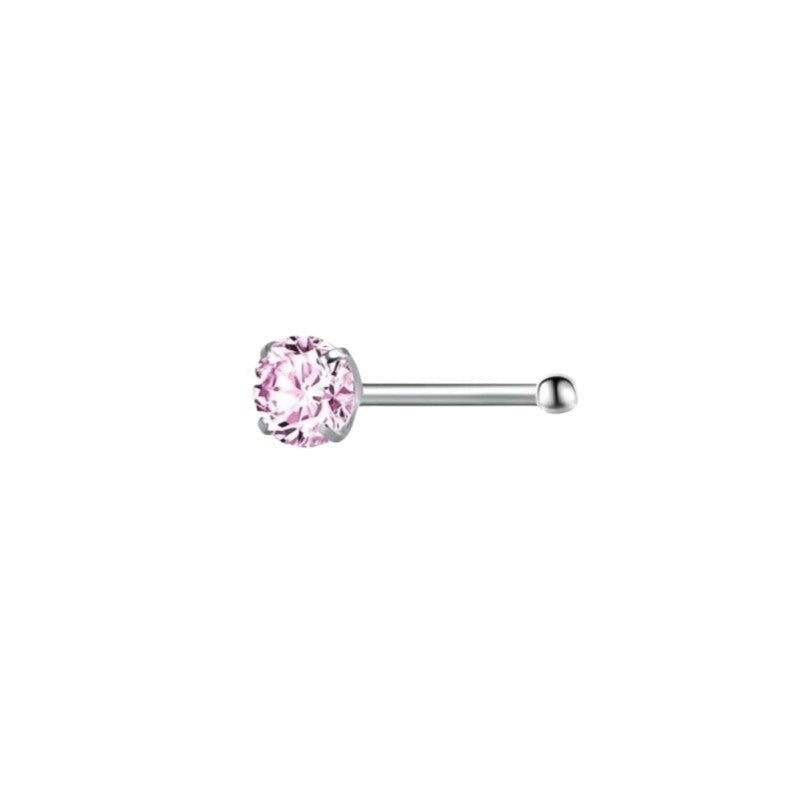 Drie roze kristallen neuspiercings met een enkele roze kristal