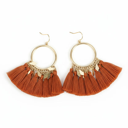 Boucles d'oreilles à pompons avec breloques en diamant