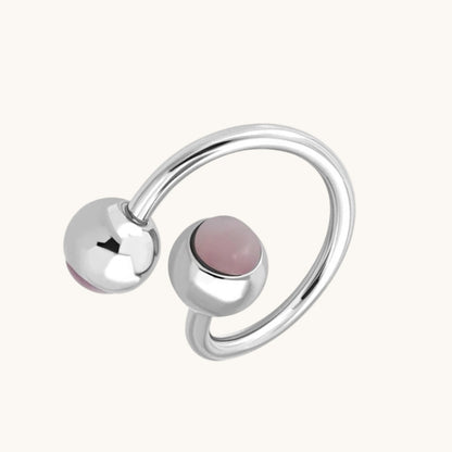 Piercing au nombril en spirale d'acier œil de chat rose