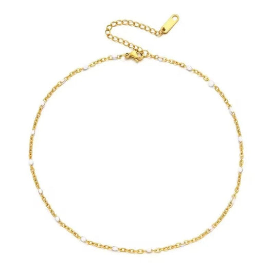 De gouden schakelarmband met parels