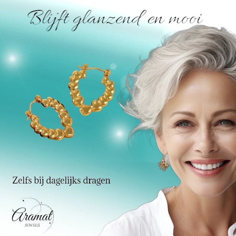 Stainless steel druppelvormige oorringen met hartjesmotief - oor6405 - 792418 - Oorringen kopen# - 26mm - alles - cadeau