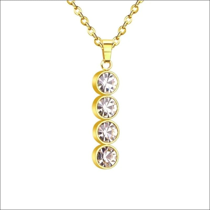 Een gouden hanger met drie stenen