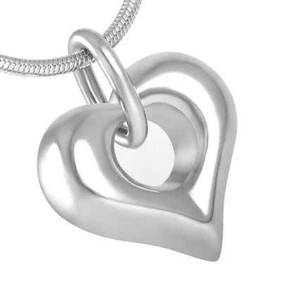 Heart-shaped ash jewelry with open detail – steel